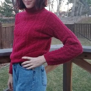 Red cable knit turtleneck